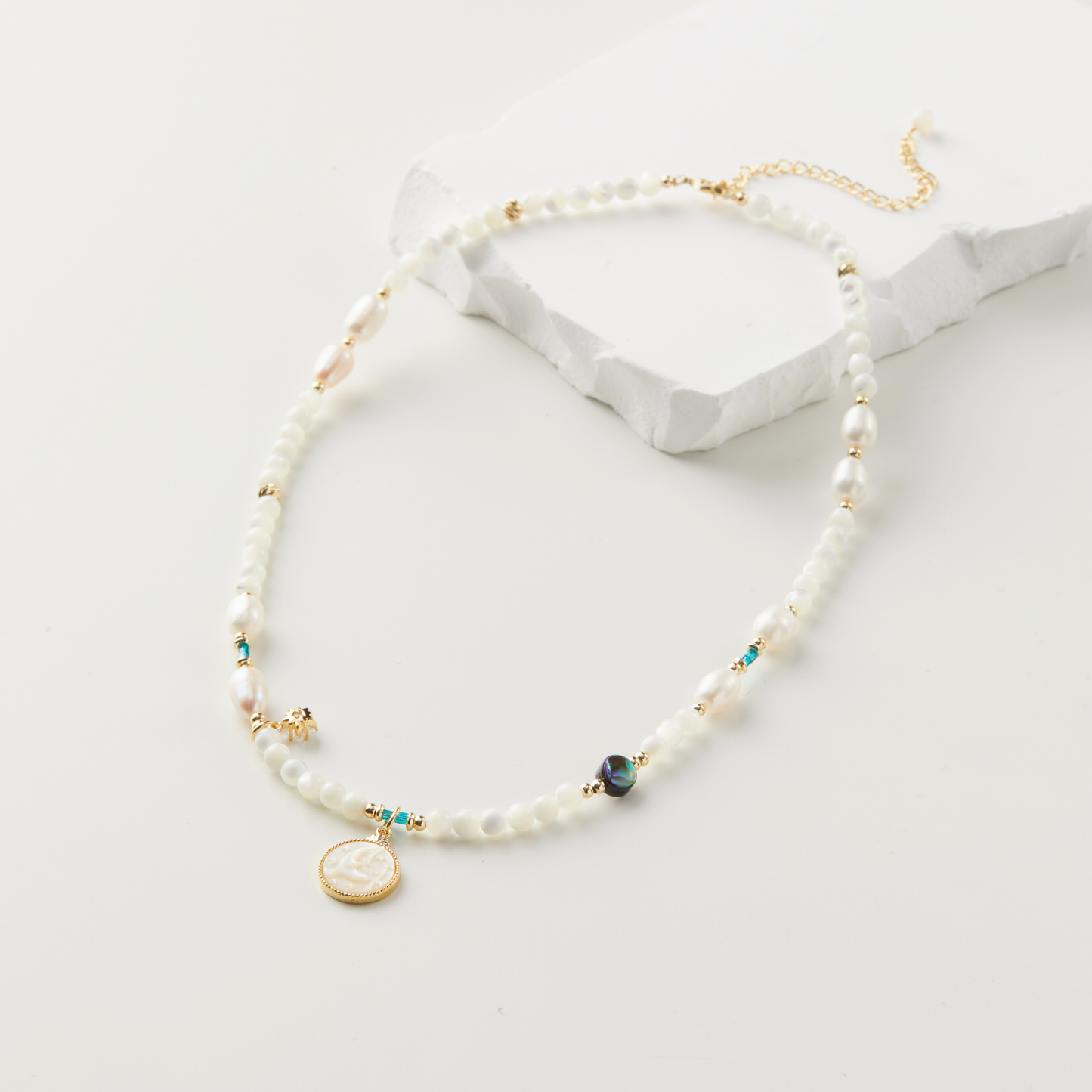 Artisan Necklace with Mermaid Conch Shell, Freshwater Pearls, Star-Shaped Zircon, and Black Abalone