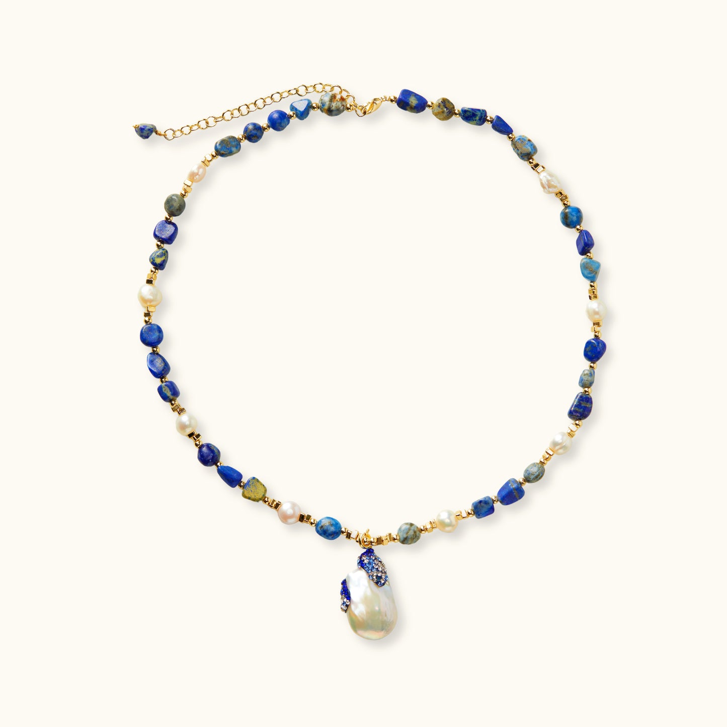 Handcrafted necklace with lapis lazuli and Baroque pearl with gradient blue and white zirconia accents